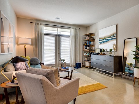 a living room with a couch and a chair